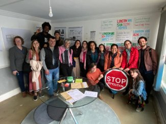 Workshop participants visiting Lesnes Estate occupation in London, with members of Housing Rebellion.